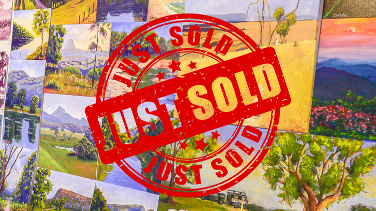 Sold stamp on top of studio paintings
