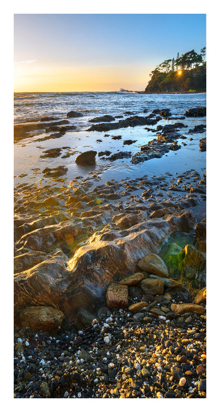 Sunrise Glow on Pebbles
