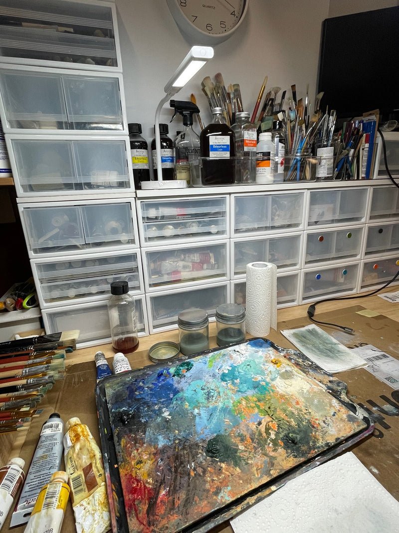 Geoff Barlow's paint palette, brushes and materials in his studio