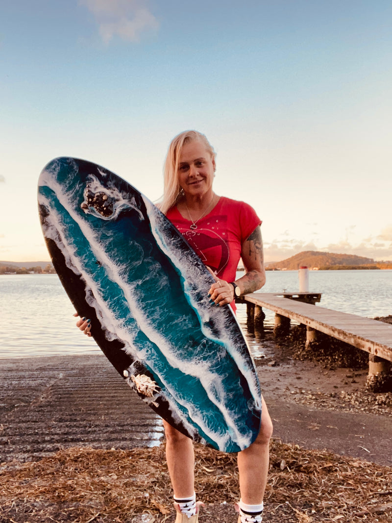 Kelly Stewart with her ocean-inspired resin surfboard artwork