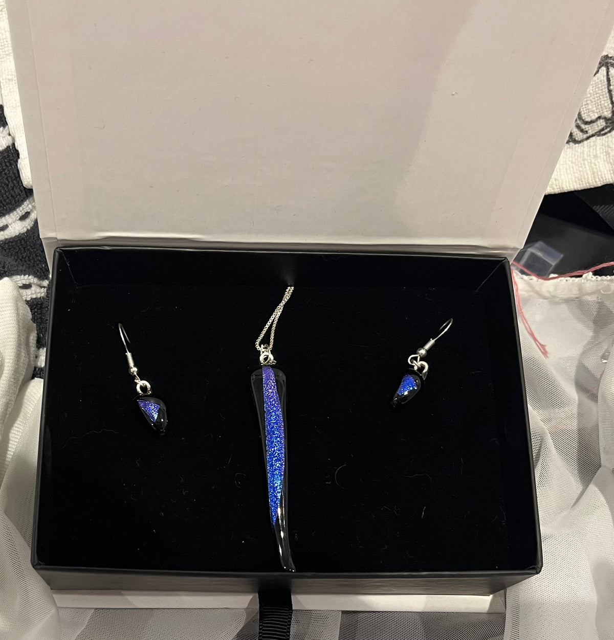 Boxed dichroic glass earring and pendant sets by Cherie Platen