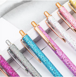 Collection of glittery pens in pink, blue, silver and white