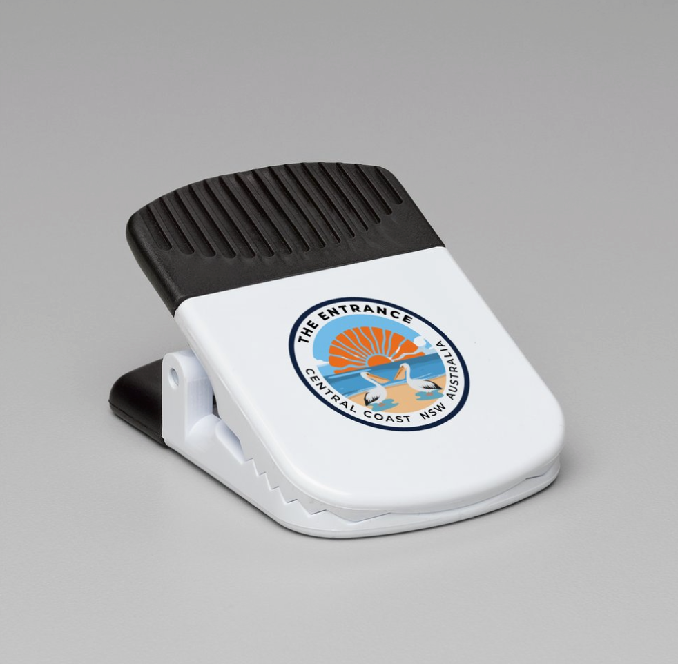 White and black magnetic clip with The Entrance logo