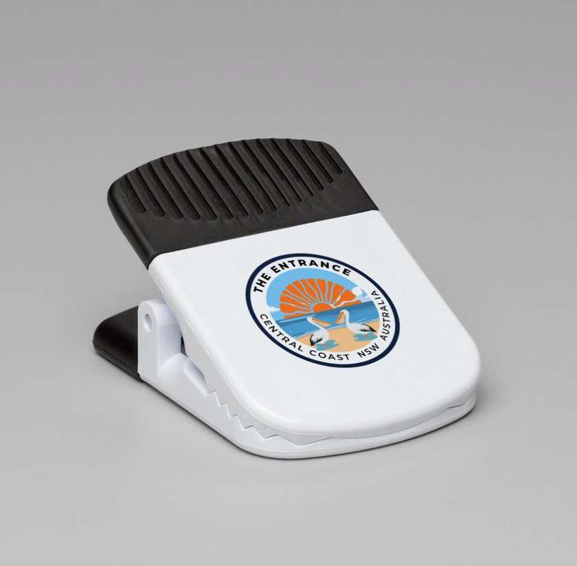 White and black magnetic clip with The Entrance logo