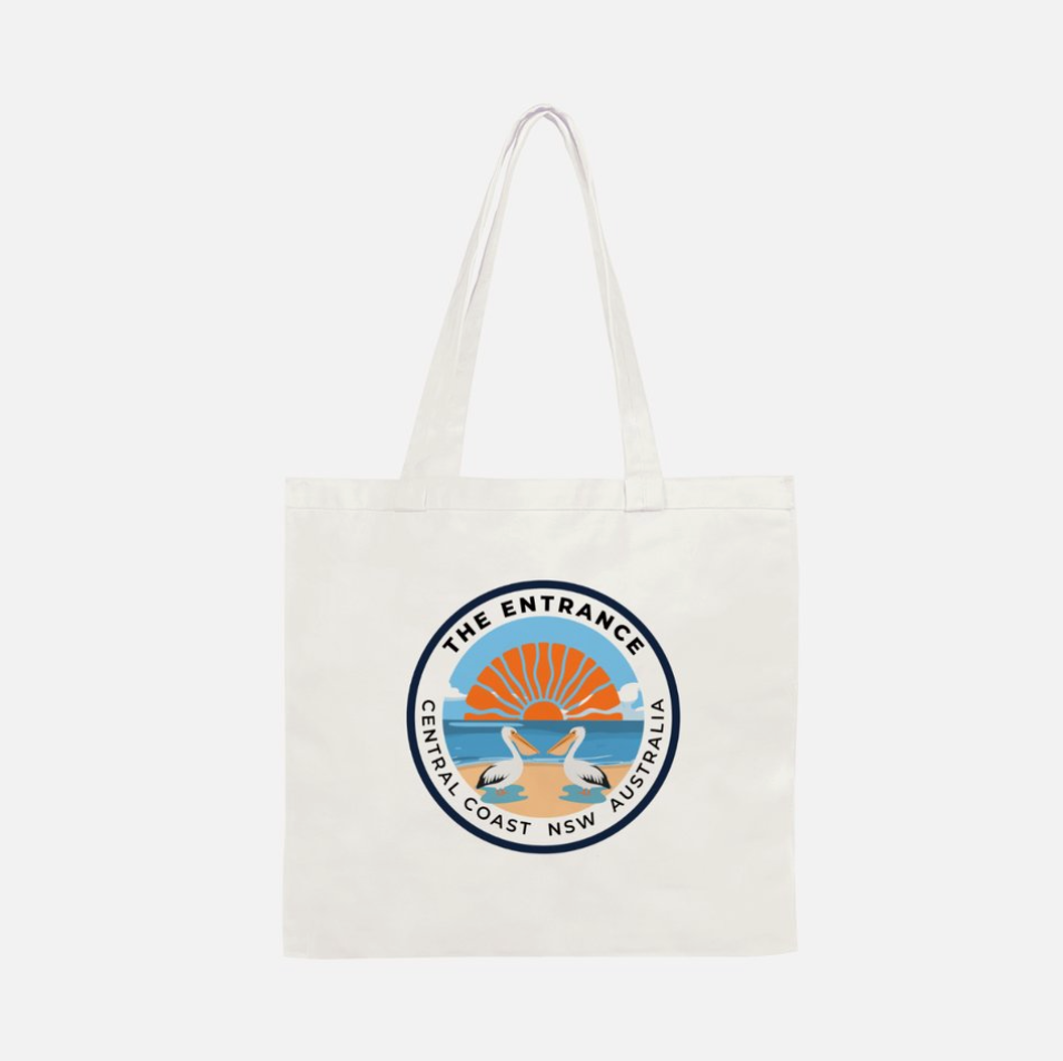 White tote bag with a circular logo The Entrance Central Coast NSW with two pelicans and rising sun