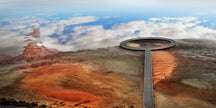 Circular metal boardwalk out to sky and clouds reflected in water at Lake Tyrell, salt lake in Victoria