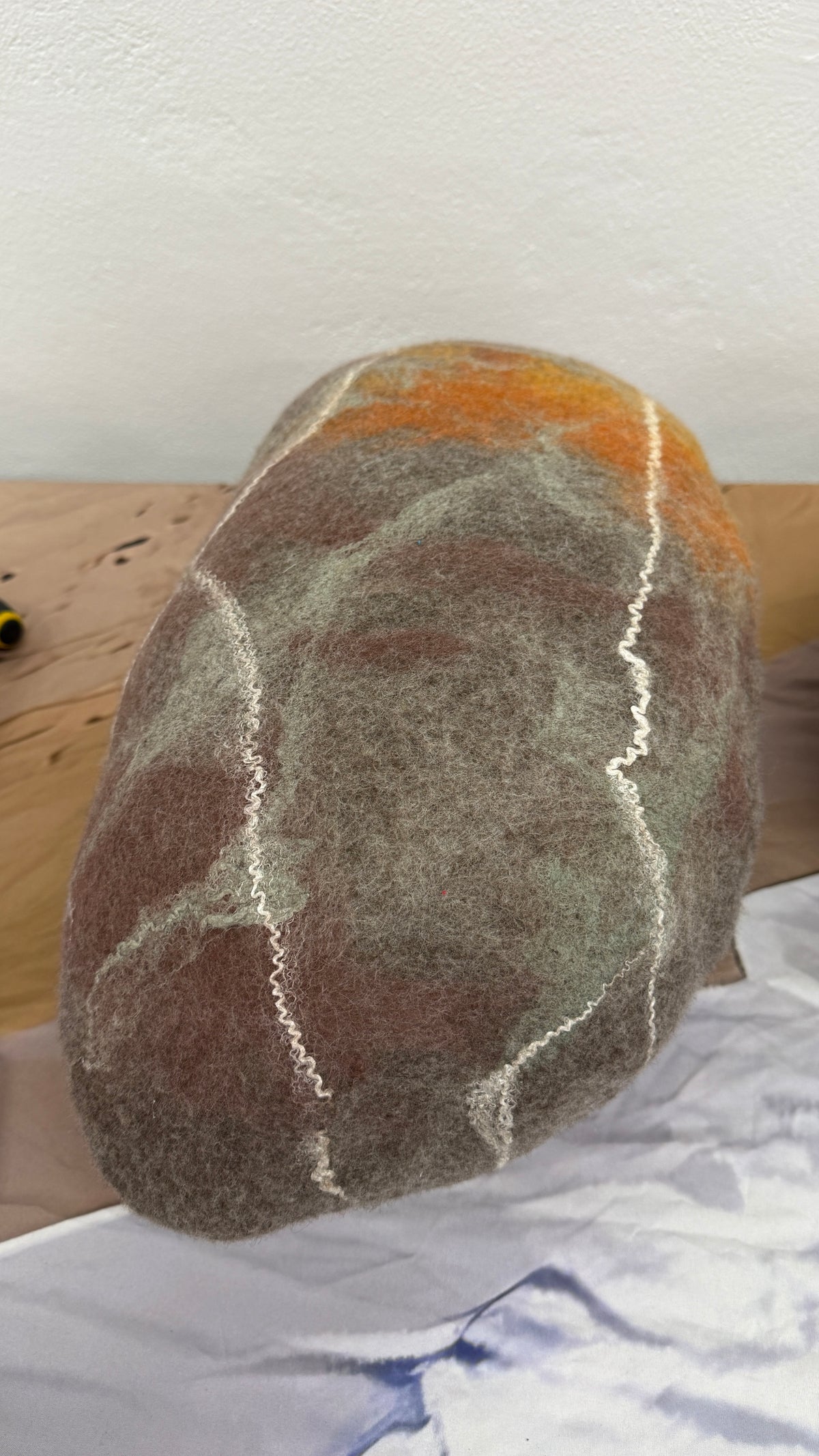 Karen Jane Williams wool felt sculpture — Large Stone of Wool - orange