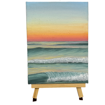 Oil painting of an ocean at sunset on a wooden stand