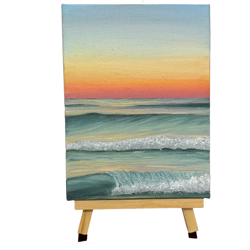Oil painting of an ocean at sunset on a wooden stand